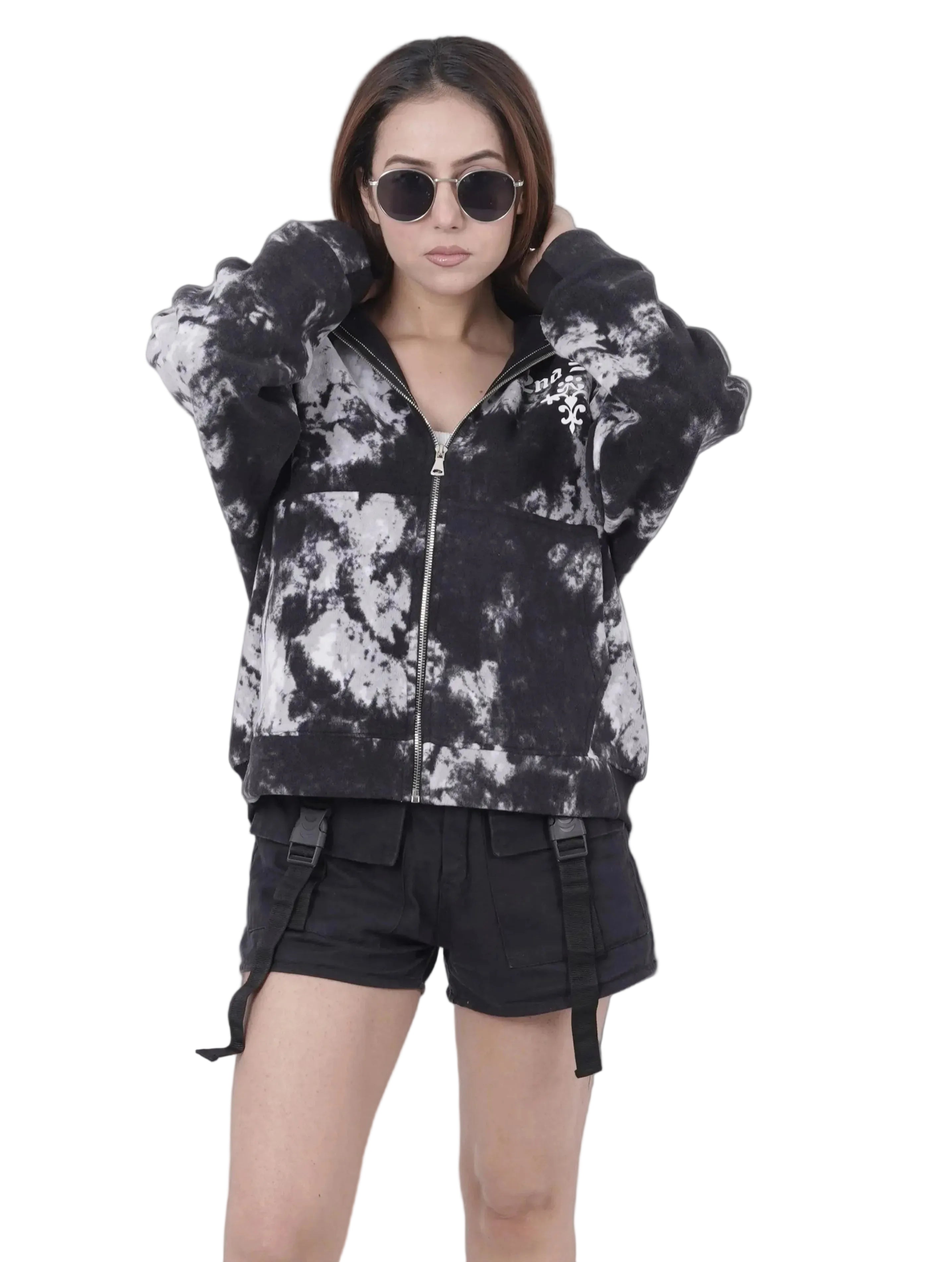 Person wearing a black and white outfit on a white background